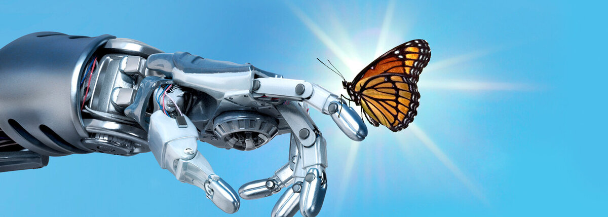 Schmetterling sitzt auf Zeigefinger von Roboterarm